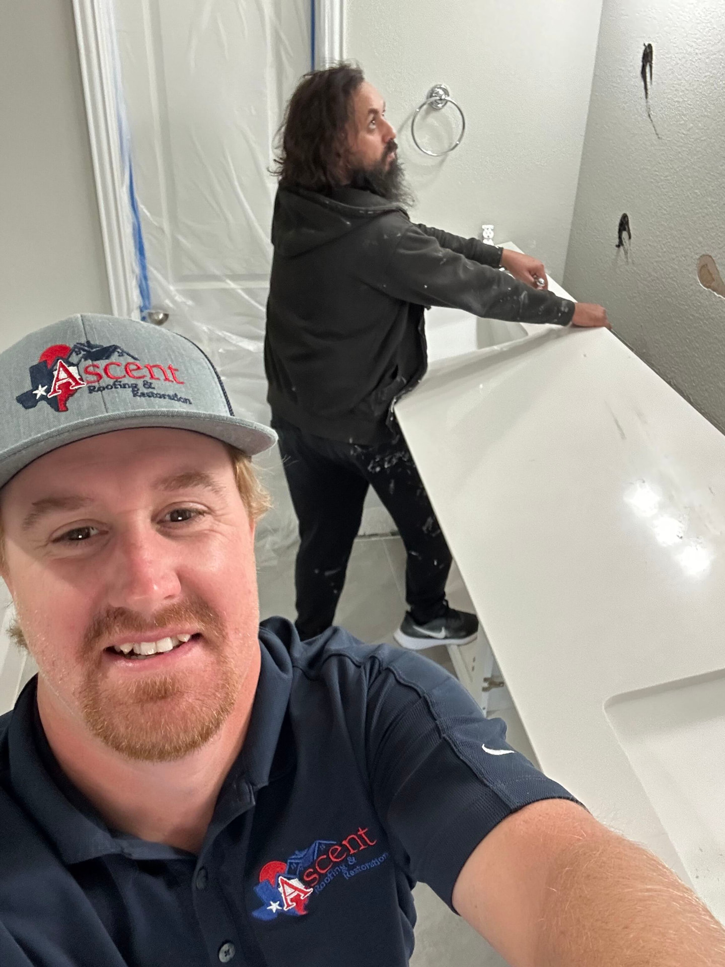 Ascent team working inside a bathroom during restoration